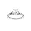 Round-cut diamond engagement ring with a plain band and hidden-halo setting.