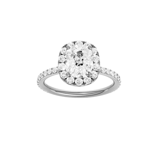 Elongated cushion-cut diamond engagement ring with a prong-set diamond band and halo setting.