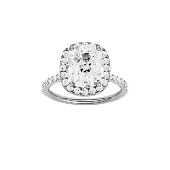 Elongated cushion-cut diamond engagement ring with a prong-set diamond band and halo setting.