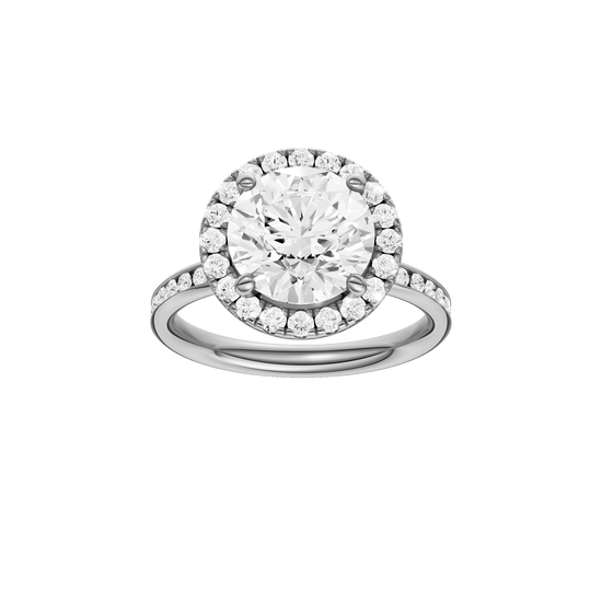 Round-cut diamond engagement ring with a channel-set diamond band and halo setting.
