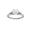 Round-cut diamond engagement ring with a prong-set diamond band and solitaire setting.