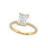 A three-quarter view of the Emerald cut diamond engagement ring in 14k yellow gold with a prong diamond band and cathedral setting