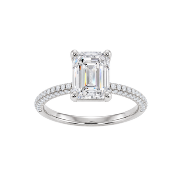 A front view of the Emerald cut diamond engagement ring in 14k white gold with a prong diamond band and cathedral setting