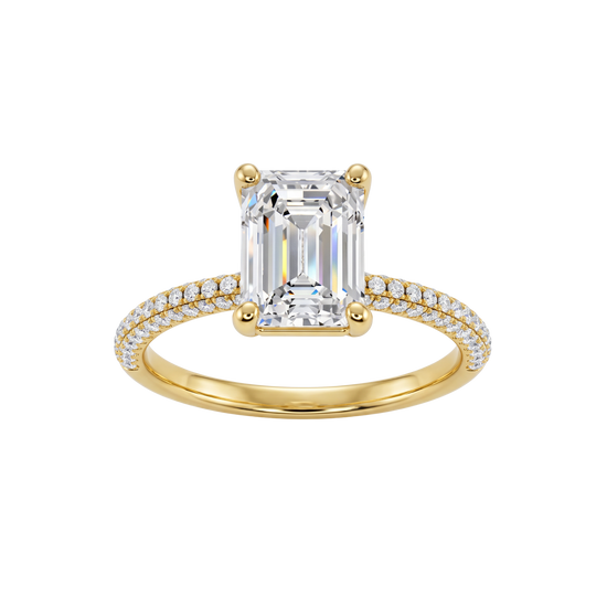 A front view of the Emerald cut diamond engagement ring in 14k yellow gold with a prong diamond band and cathedral setting