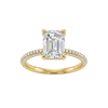 A front view of the Emerald cut diamond engagement ring in 14k yellow gold with a prong diamond band and cathedral setting