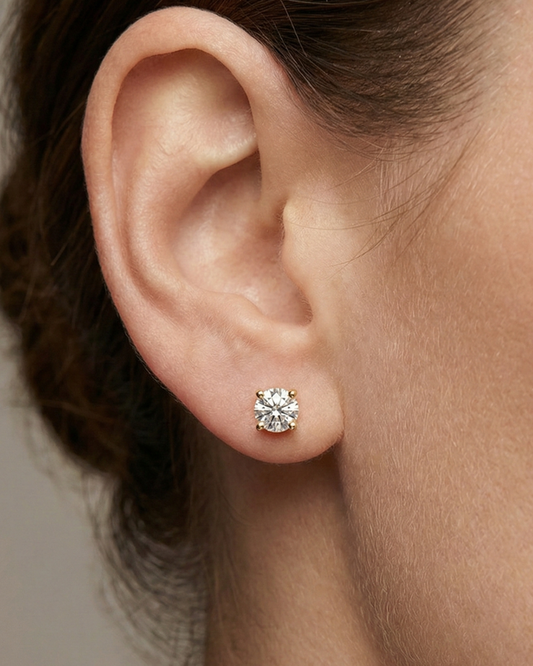 Amorati 1ctw Bold Power Studs lab grown and hand selected with E-F colorless VS+ clarity featuring oversized 14K Gold baskets for stability - Double the gold weight of standard retail studs pictured on the models left ear.