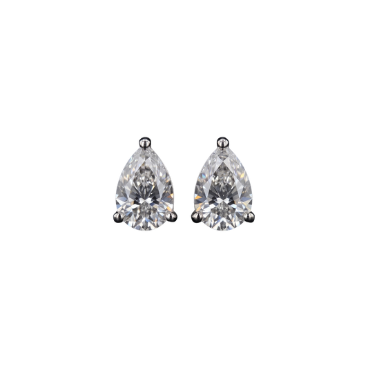 Front view of a pair of pear-shaped diamond stud earrings in a white metal setting.