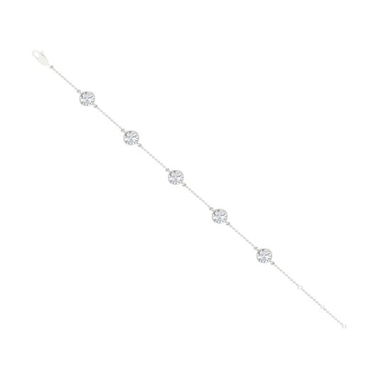 A full top-down view of a 14K white gold bracelet, showing the spaced-out, bezel-set diamonds on the delicate chain.