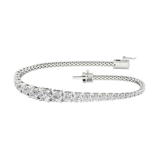 A full top-down view of a 14K white gold tennis bracelet, coiled to show the cascading line of round diamonds and the clasp.
