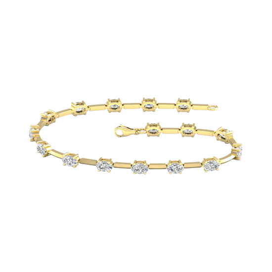 A full top-down view of a 14K yellow gold tennis bracelet, coiled to show the continuous line of square-cut diamonds.