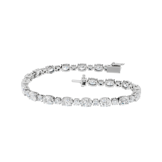 Front view of an oval-cut diamond tennis bracelet in white gold, featuring a continuous row of oval diamonds set in a sleek, articulated design.