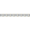 Close-up view of emerald cut white diamonds set in a yellow gold tennis bracelet, highlighting the stone settings and warm gold tone.