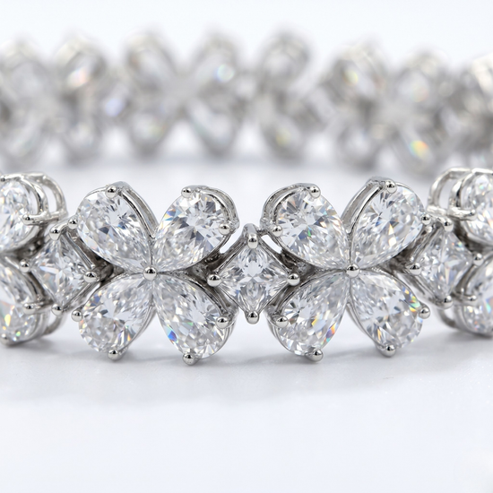 Close-up detail of the Amorati Signature 17-Carat Diamond Tennis Bracelet in white gold, featuring alternating pear-cut diamond floral clusters and square-cut diamonds.
