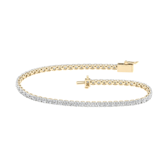 A full top view of the 14K yellow gold tennis bracelet, coiled to show the continuous, brilliant line of diamonds.