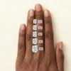 Elongated cushion diamond carat comparison 1, 2, 3, 4, 5 on a hand.