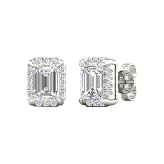 Angled view of white gold emerald-cut halo diamond stud earrings highlighting the clean step-cut facets, halo sparkle, and polished metal finish.