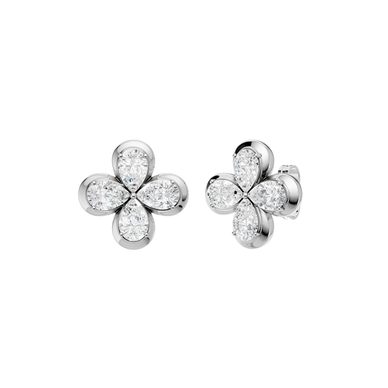 Angled view of white gold floral diamond stud earrings highlighting the dimensional flower motif, marquise-cut diamond sparkle, and polished metal finish.