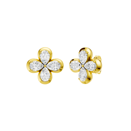 Angled view of yellow gold floral diamond stud earrings highlighting warm gold tones, dimensional flower detailing, and diamond sparkle.