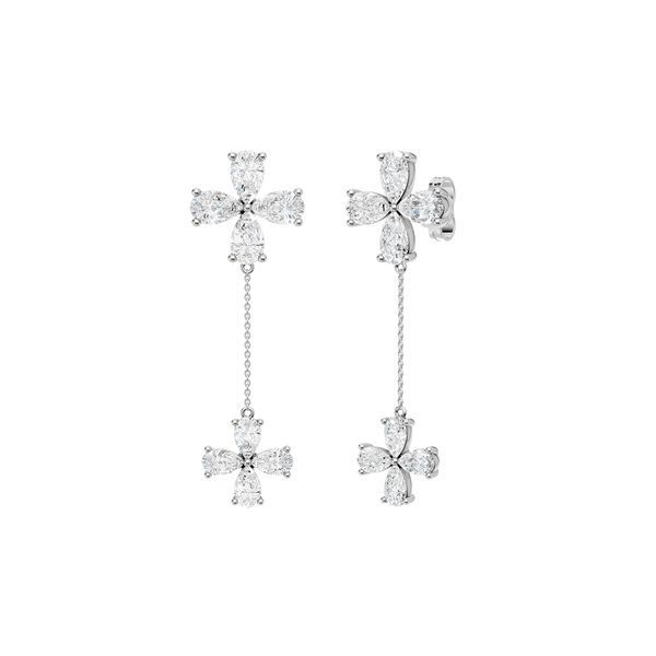 Angled view of white gold floral diamond drop earrings highlighting the dimensional flower design, articulated movement, and diamond brilliance.