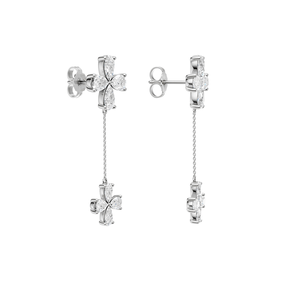 Back view of white gold floral diamond drop earrings displaying polished metal backs, chain detailing, and refined construction.