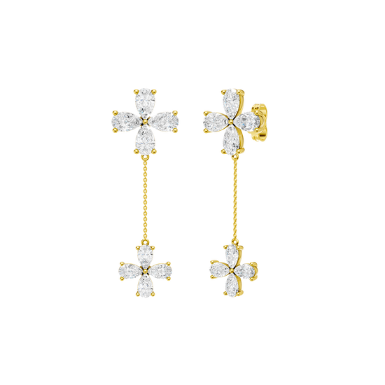 Angled view of yellow gold floral diamond drop earrings highlighting warm gold tones, dimensional flower detailing, and diamond sparkle.