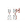 Amorati Diamonds Emerald and Pear Diamond Drop Earrings in 14K Rose gold. these drop stud earrings featuring an emerald-cut clear gemstone in the top and a pear-cut clear gemstone in the bottom, shown on a solid white background.