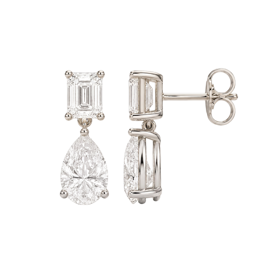 High-polish 14k white gold drop earrings by Amorati featuring a mismatched emerald-cut and pear-cut lab-grown diamond for a modern look.