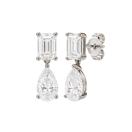 High-polish 14k white gold drop earrings by Amorati featuring a mismatched emerald-cut and pear-cut lab-grown diamond for a modern look.