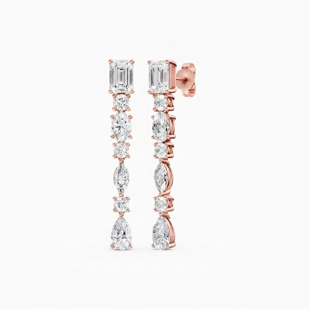 Amorati Diamond Multi-shape Diamond Drop Earrings. A pair of 14K rose gold drop earrings with lab grown diamond baguette, round, pear and marquise-cut diamonds, shown on a solid white background.