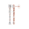 Amorati Diamond Multi-shape Diamond Drop Earrings. Side view of a pair of 14K rose gold drop earrings with lab grown diamond baguette, round, pear and marquise-cut diamonds, shown on a solid white background.