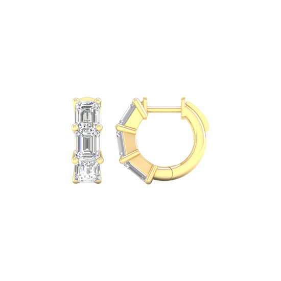 A side profile of a 14K yellow gold huggie hoop, showing the three stacked baguette diamonds.