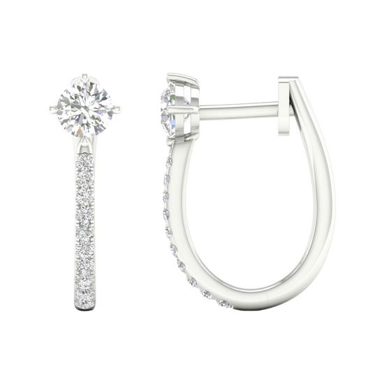 A profile view of a 14K white gold huggie hoop, showcasing the thin band and the drop design.