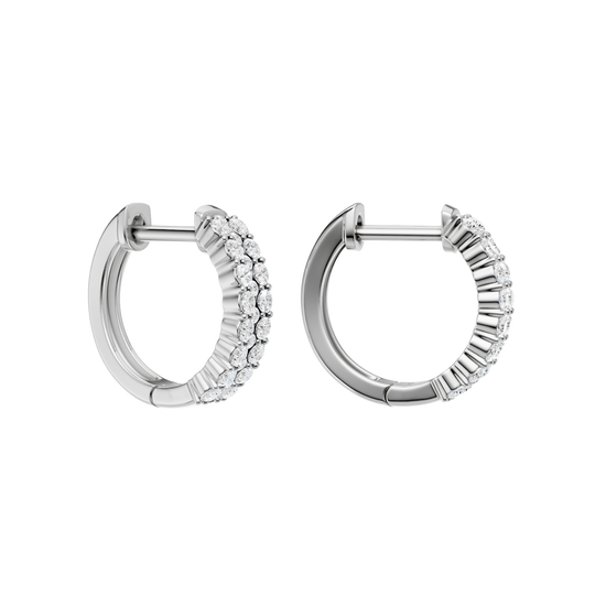 An angled view of a 14K white gold huggie hoop highlighting its wide double-row style.