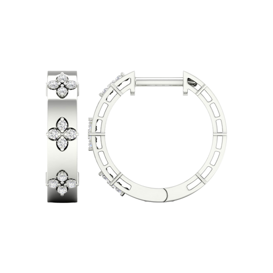 An angled view of a pair of 14K white gold huggie hoop earrings with a diamond floral design from the Amorati Collection. The hinge closure is visible.