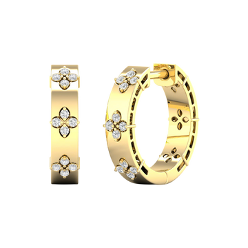A pair of 14K yellow gold huggie hoop earrings with diamond clover accents from the Amorati Collection, displayed in both front and angled views to showcase the intricate design and thickness.