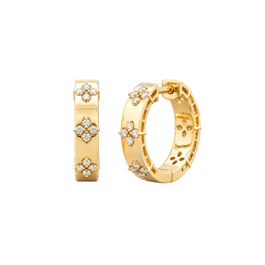 A pair of 14K yellow gold huggie hoop earrings with diamond clover accents from the Amorati Collection, displayed in both front and angled views to showcase the intricate design and thickness.
