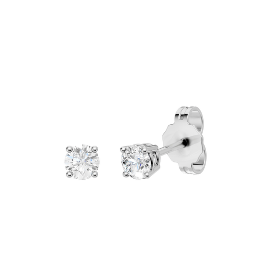 Angled view of white gold round diamond stud earrings highlighting diamond brilliance, prong detail, and polished metal finish.