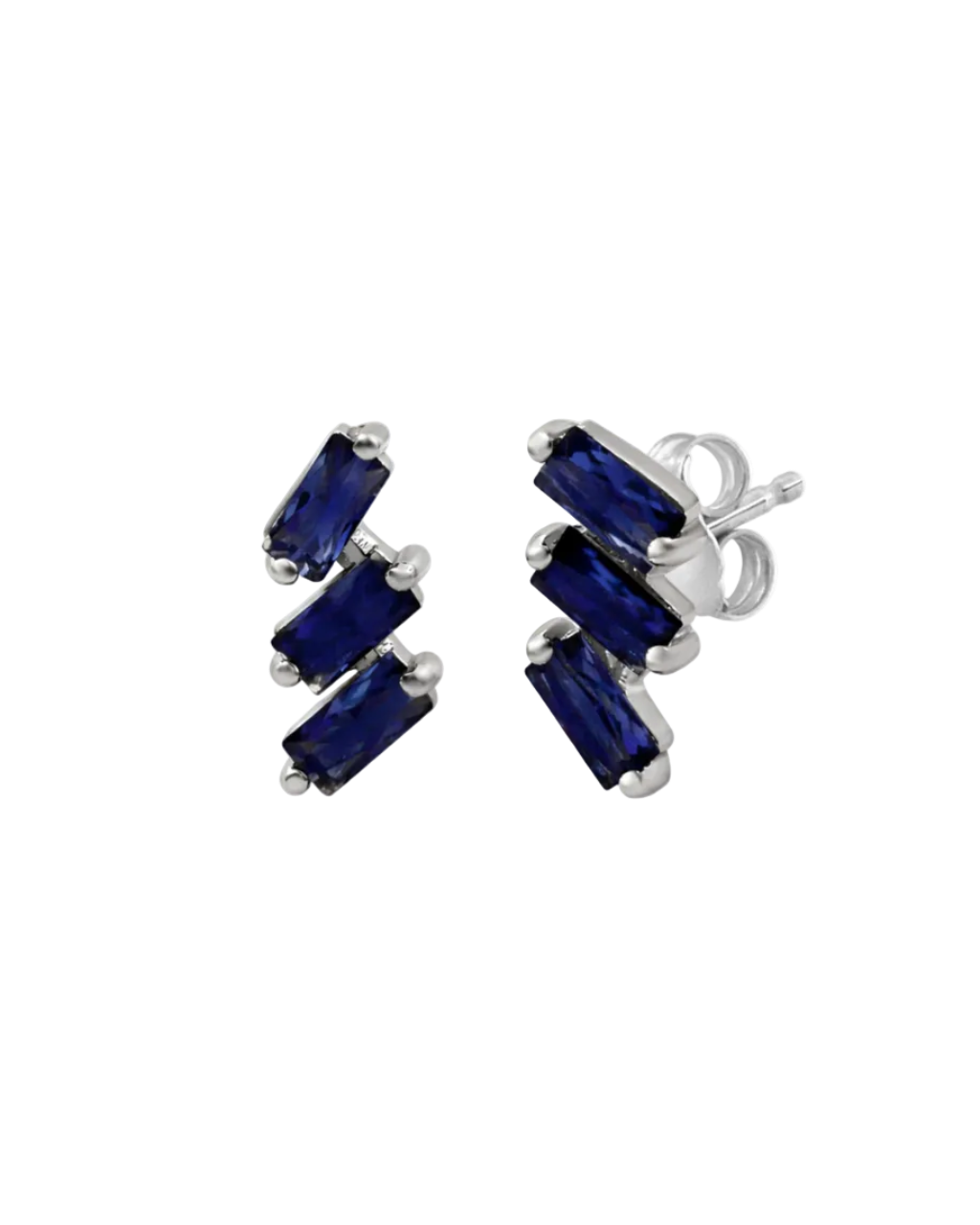 A pair of cascading stud earrings featuring a vertical arrangement of three baguette-cut blue sapphires. The rectangular gemstones are staggered in a step-like formation and held in a minimalist 18k white gold setting, shown against a clean, white studio background.
