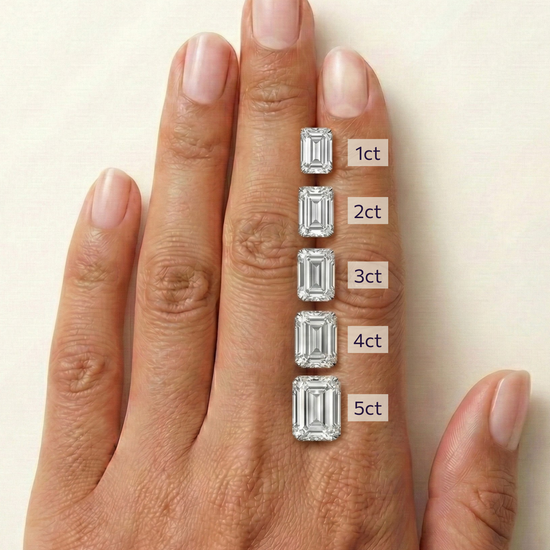 On-hand comparison of emerald cut diamonds from 1 carat, 2 carat, 3 carat, 4 carat, 5 carat.