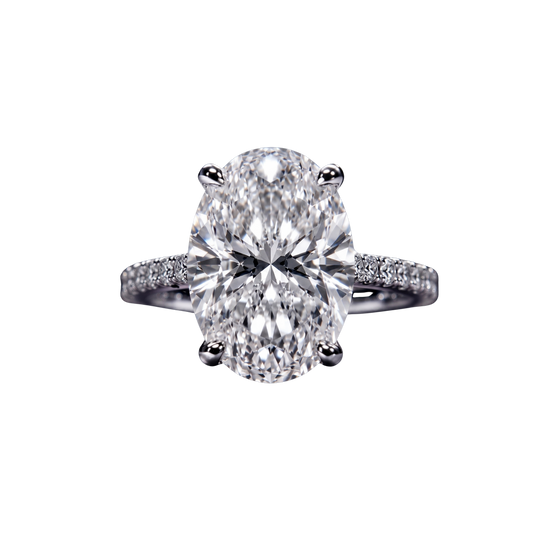 Top-down view of a classic white gold or platinum engagement ring featuring a large brilliant oval-cut center diamond on a sparkling micro-pavé diamond band.