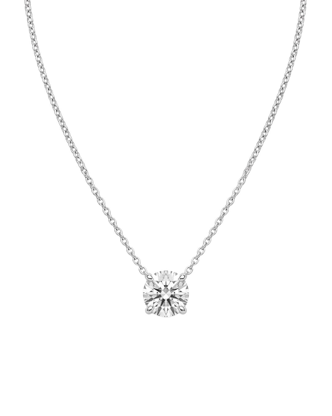 Product shot of a delicate silver-tone chain necklace featuring a brilliant round-cut clear gemstone in a four-prong setting, displayed against a white background.