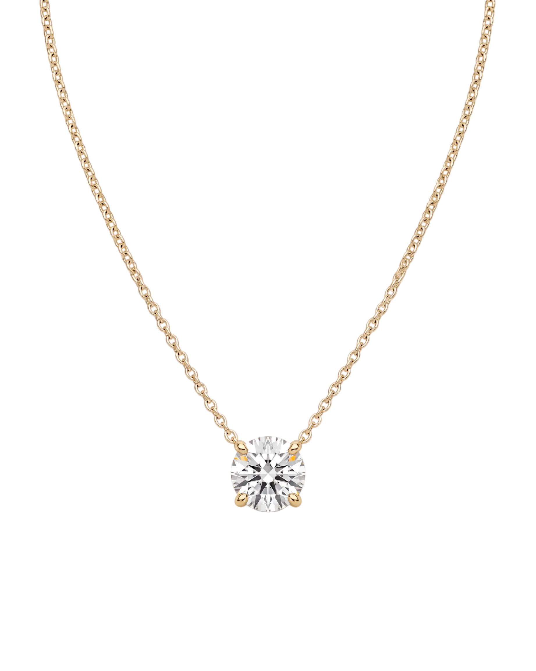 Product shot of a delicate yellow-tone chain necklace featuring a brilliant round-cut clear gemstone in a four-prong setting, displayed against a white background.