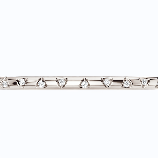 A sleek, high-polish 14k white gold bangle from the Amorati Fourteen Collection, featuring scattered star insets with shimmering round lab-grown diamonds.