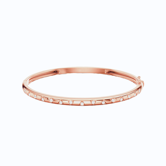 Amorati Diamond Multishape Studded Thin Bangle is a slim 14K rose gold bracelet with a row of stamped shapes inset with round lab grown diamonds on a plain white background.