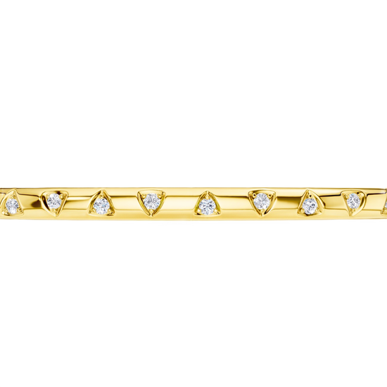 A sleek, high-polish 14k yellow gold bangle from the Amorati Fourteen Collection, featuring scattered star insets with shimmering round lab-grown diamonds.