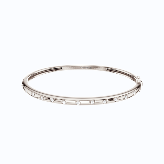 A substantial, high-polish 14k white gold wide cuff from the Amorati Fourteen Collection, featuring scattered star and geometric insets with shimmering round lab-grown diamonds.