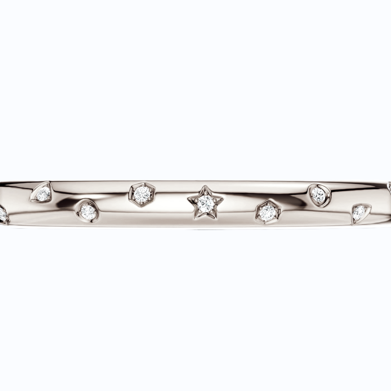 Amorati Diamonds Multi Shape Studded Diamond Bangle in 14K white gold. The bracelet featuring a row of small star, triangles and other shapes inset with round lab grown diamonds, shown against a plain white background.