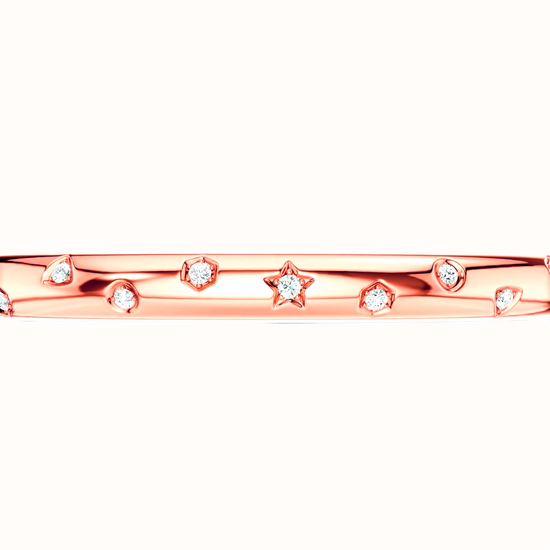 Amorati Diamonds Multi Shape Studded Diamond Bangle in 14K rose gold. The bracelet featuring a row of small star, triangles and other shapes inset with round lab grown diamonds, shown against a plain white background.
