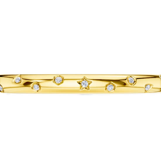 A bold, high-polish 14k yellow gold statement bangle by Amorati featuring scattered star and geometric insets with shimmering round-cut lab-grown diamonds. Amorati’s signature F O U R T E E N T H Collection