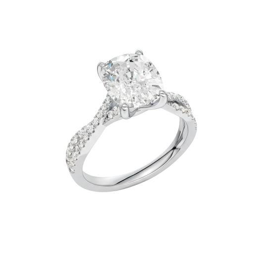 A three-quarter view of the Elongated Cushion diamond engagement ring in 14k white gold with a prong diamond band and cathedral setting